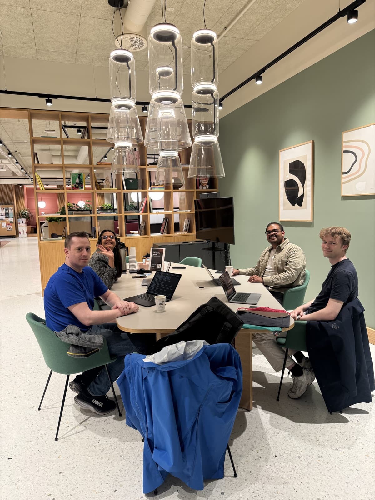 The Oslo Vibe Coding group smiling during a free drop-in session at Spaces Stortorvet, Oslo