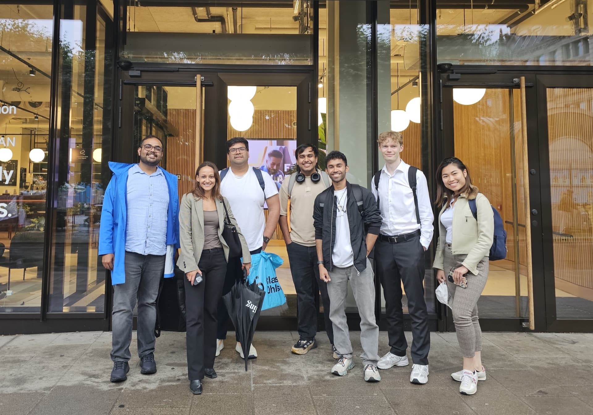 Seven people who attended the Oslo Vibe Coding spec-driven development session standing together outside Spaces Stortorvet