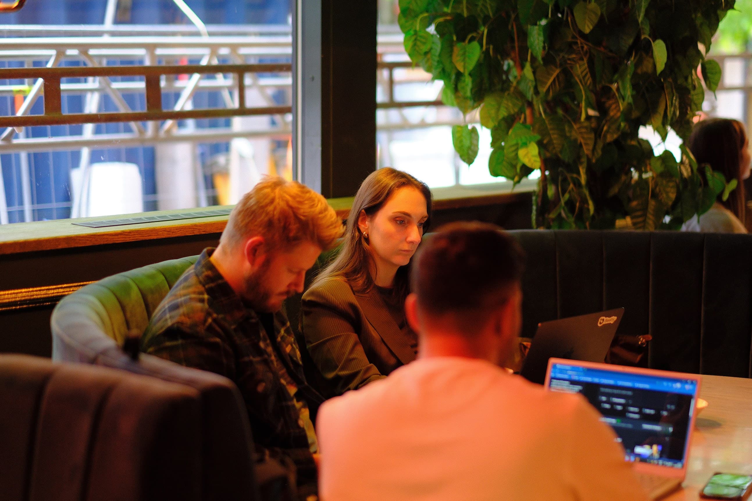 Participants gathered around laptops during the workshop
